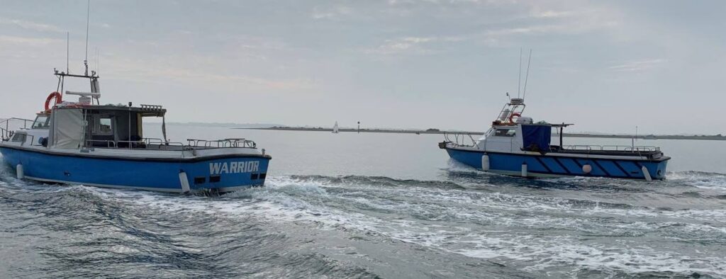 Boats cruising coastal waters